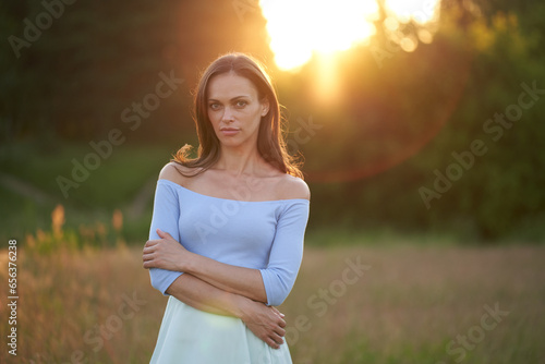 pretty brunette wonan in the summer park photo