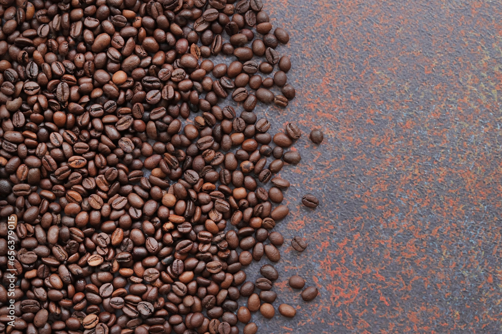 Top view of a background representing halves of dark brown coffee beans. Roasted coffee beans, copy space. Brown coffee beans on a bright spotted background Top view of a background representing halves of dark brown coffee beans. Roasted coffee beans, copy space. Brown coffee beans on a bright spotted background