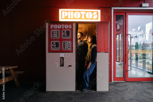 Group of friends taking a photo at the photobooth