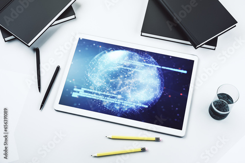 Top view of modern digital tablet monitor with abstract programming language hologram and world map, artificial intelligence and neural networks concept. 3D Rendering
