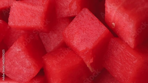 watermelon pieces, rotation in circle. juicy red watermelon without peel, Turning. selective focus. fruit and berry season. Vertical video