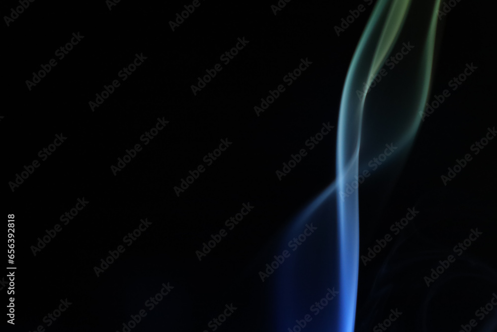Yellow and blue smoke on a dark background, colourful abstract, one line, minimalistic art, computer graphics, perfect surface Yellow and blue smoke on a dark background, colourful abstract, one line, minimalistic art, computer graphics, perfect surface