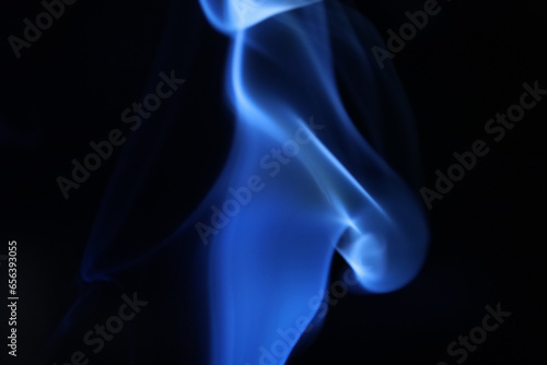Blue smoke on a dark background, fog pattern, detailed smoke shapes 