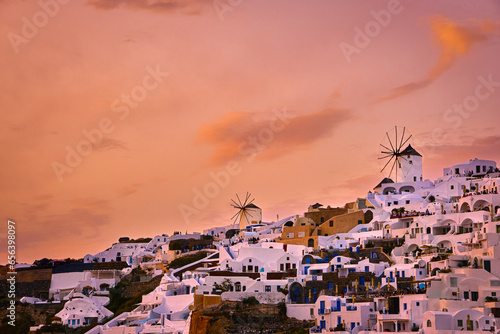 Obraz na płótnie Oia village, windmills, Santorini island, Greece at colorful sunset w salonie