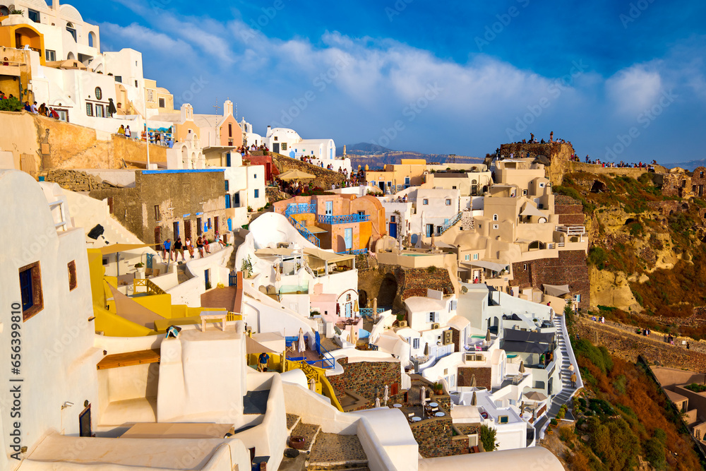 Oia castle ruins, Santorini, Greece and Oia village before sunset