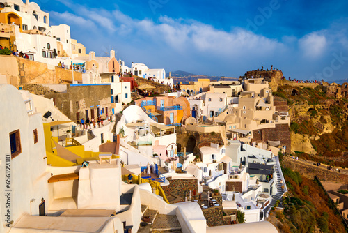 Obraz na płótnie Oia castle ruins, Santorini, Greece and Oia village before sunset w salonie