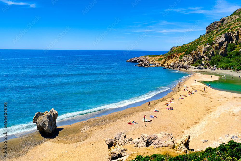 Panorama of sunny day at Preveli beach, Crete island, Greece.