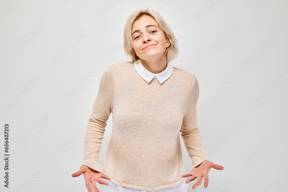 Portrait of student girl showing empty pockets isolated on white studio background. Financial crisis, no money concept Portrait of student girl showing empty pockets isolated on white studio background. Financial crisis, no money concept