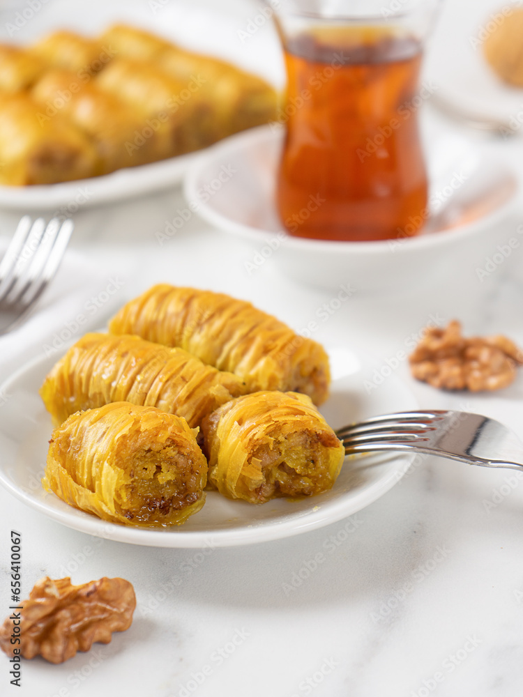Pistachio baklava. Close-up baklava isolated on white background. Mediterranean cuisine delicacies Pistachio baklava. Close-up baklava isolated on white background. Mediterranean cuisine delicacies