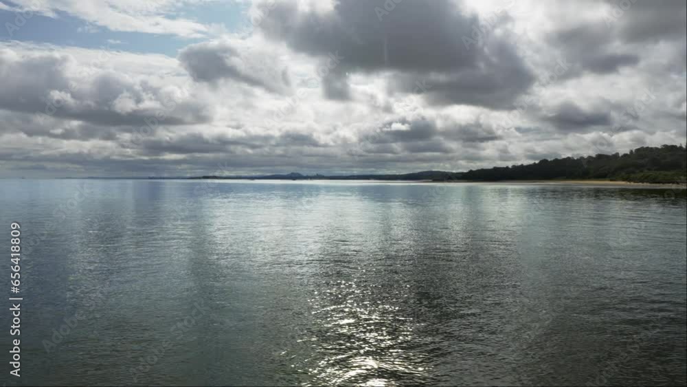 Seascape with dramatic sky and dark clouds reflecting on the sea, Edinburgh, Scotland. Seascape with dramatic sky and dark clouds reflecting on the sea, Edinburgh, Scotland.