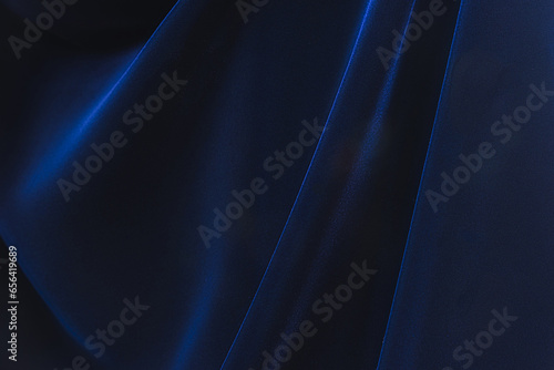 Navy blue velvet fabric. Velvet shiny dark blue fabric. Dark luxury background with space for design. Flat lay, top view table. Beautiful.Elegant.Birthday,Christmas.
