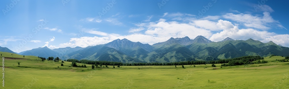 panorama of mountains with green meadows and blue sky during the day.