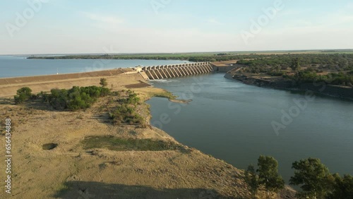 High aerial fly up Vaal River, over Bloemhof Dam wall with high water level photo