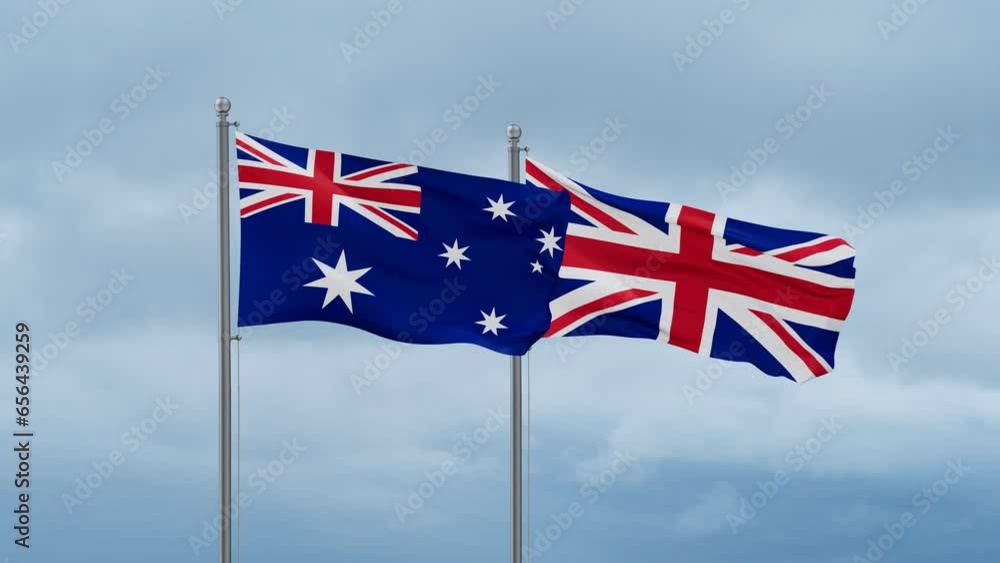 United Kingdom and Australia flag waving together on cloudy sky, endless seamless loop, two country cooperation concept United Kingdom and Australia flag waving together on cloudy sky, endless seamless loop, two country cooperation concept