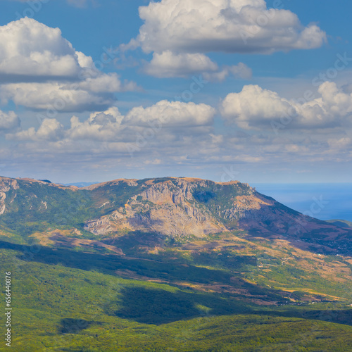 green mountain valley under dense clouds