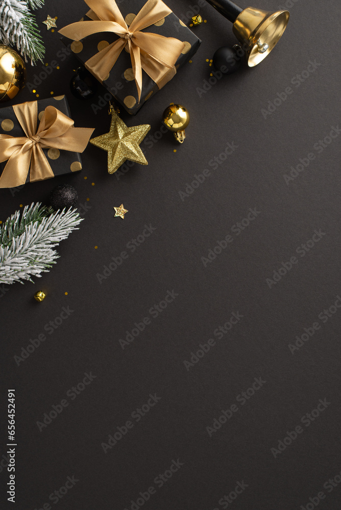 Upscale Yuletide dreams theme. Top view vertical shot of sumptuous gift parcels, expensive tree ornaments, balls, shiny confetti, bell, frost-covered evergreen sprigs on dark backdrop for festive ad Upscale Yuletide dreams theme. Top view vertical shot of sumptuous gift parcels, expensive tree ornaments, balls, shiny confetti, bell, frost-covered evergreen sprigs on dark backdrop for festive ad
