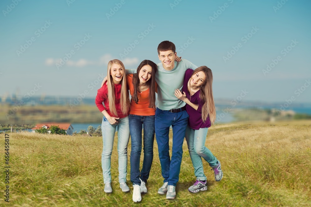 Happy young friends walk together in the countryside Happy young friends walk together in the countryside