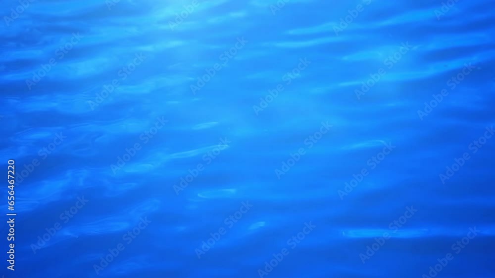 Natural background with sun glints on the surface of water. Ripples reflected on the water's surface. Natural background with sun glints on the surface of water. Ripples reflected on the water's surface.