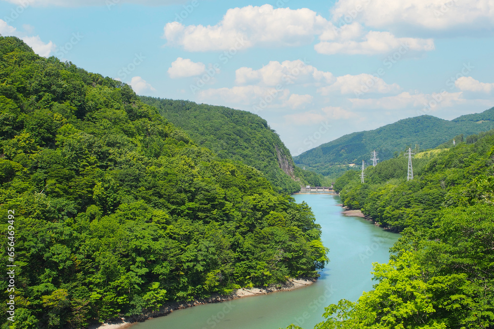 Fototapeta premium Landscape picture of a Shizunai River in Hokkaido Prefecture, Japan. For use in making background images or copy space.