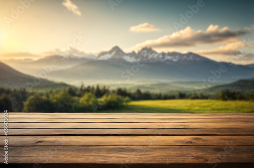 Empty wooden table with blur mountain landscape background © Nisit