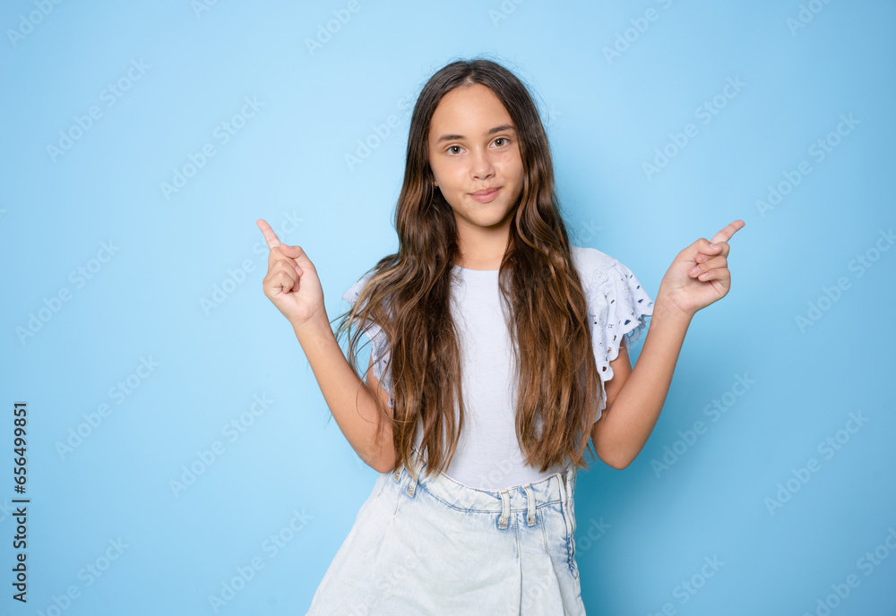 Young beautiful girl over isolated background showing and pointing up with finger number one while smiling confident and happy. Young beautiful girl over isolated background showing and pointing up with finger number one while smiling confident and happy.