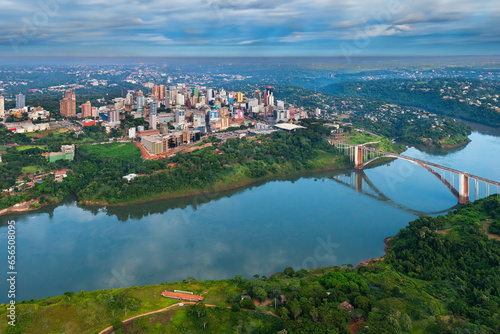 Aerial view of the Paraguayan city of Ciudad del Este and Friendship Bridge, connecting Paraguay and Brazil through the border over the Parana River,.