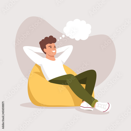Vector illustration. The boy lies or sits on an ottoman and dreams