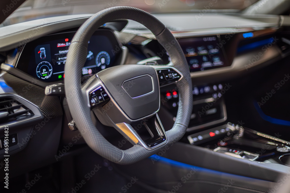 Modern car interior with steering wheel