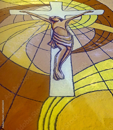 croce di gesù realizzata con sabbia colorata photo