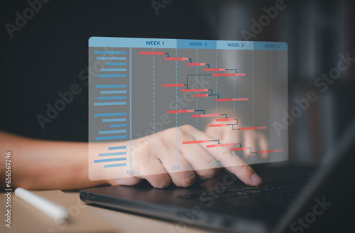 Project management with proceeding concept. Site engineer working with Gantt chart schedule to manage plan tasks and progress. Planning software for corporate strategy construction and operations.