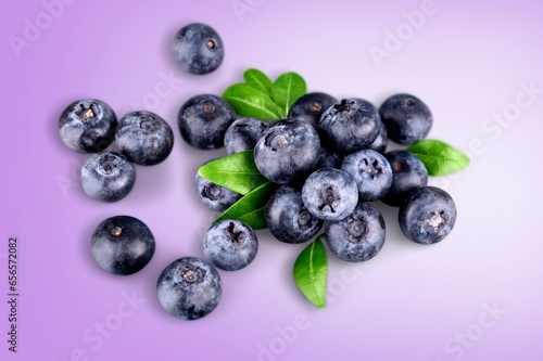 Tasty fresh ripe blueberries on the desk