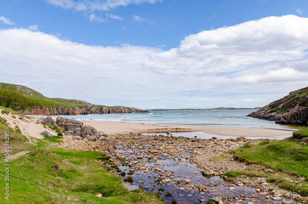 Sea coastline and a beach in Scotland. Beautiful nature on a cloudy, but beautiful day. Sea coastline and a beach in Scotland. Beautiful nature on a cloudy, but beautiful day.