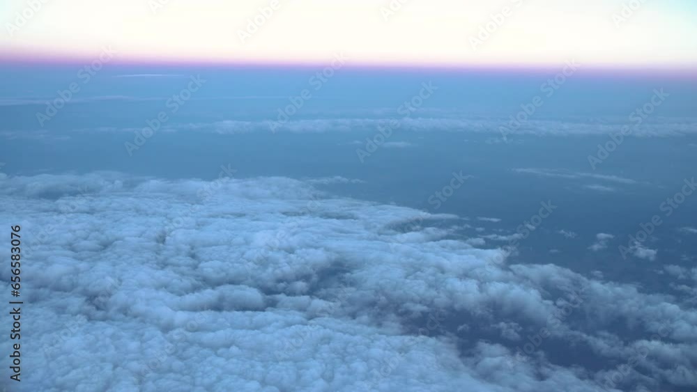 Spectacular flight through the clouds. Flight above the clouds. Airplane flight. View from the window of the plane. Airplane, Traveling by air. Spectacular flight through the clouds. Flight above the clouds. Airplane flight. View from the window of the plane. Airplane, Traveling by air.