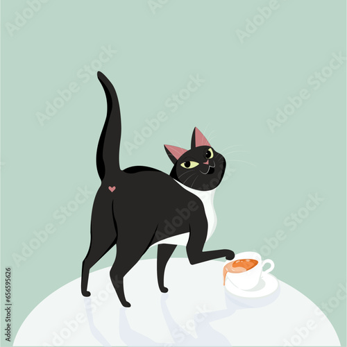 a black cat on the table overturns a cup of tea