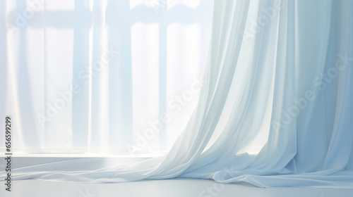 A white curtain hung in front of a window