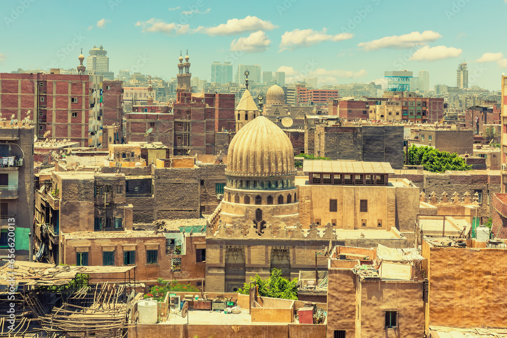 Dome of the mosque in front of old buildings of Cairo downtown, exclusive view of Egypt