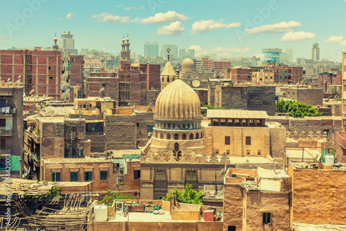 Dome of the mosque in front of old buildings of Cairo downtown, exclusive view of Egypt