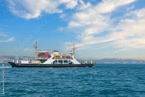 Ferry ship for transporting land transport cars and buses as well as people passengers.