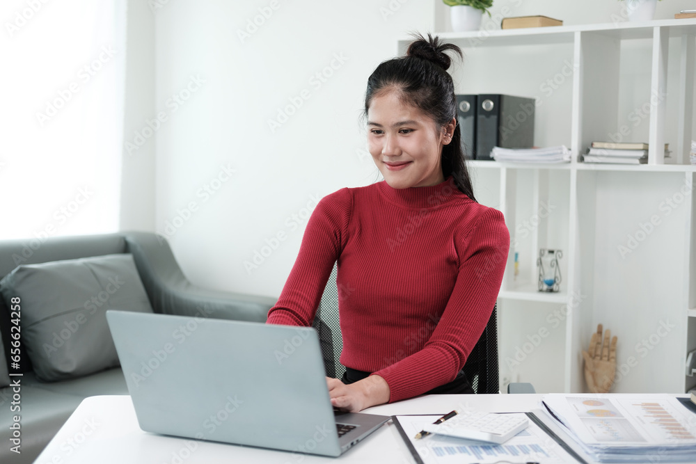 Student work process concept. Young woman working university project with generic design laptop. Analysis plans hands.