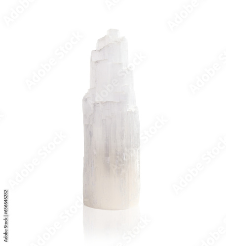 Isolated selenite crystal. Chakra healing and mediation rock or gemstone. Peaceful, calming and mental clarity properties for spirituality, healing and chakras. Selective focus. photo