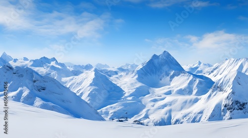 Panoramic view of snow-capped mountain peaks in winter