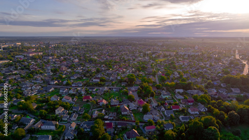 peaceful aerial living district of suburban cottages outskirts city area sun rise photo