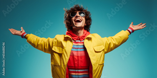 Man in a Yellow Jacket, Orange-Red Shirt, Bathed in Candlelight, Spreading Arms and Singing with Joy – Against a Petroleum Background for Conveying Pure Happiness, Celebration, Soulful Performances