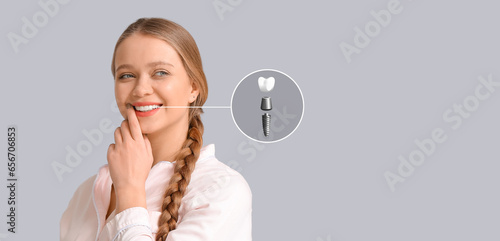 Smiling young woman with im...