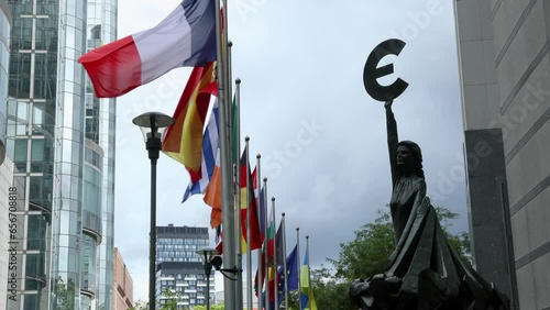 European Parliament headquarters. where European and world cultures meet. Peace Flags and states flags flying euro statues. Elections