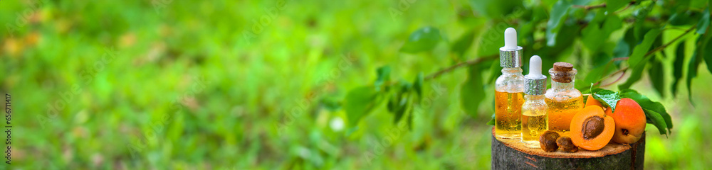 Apricot kernel oil in a bottle. Selective focus. Apricot kernel oil in a bottle. Selective focus.