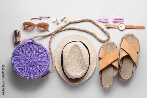 Composition with stylish female accessories and shoes on light background