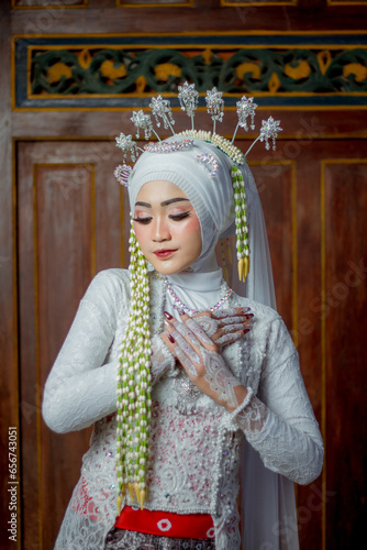 Female fashion model. female makeup model. Asian woman. Indonesian women. wearing white wedding attire. white wedding dress.