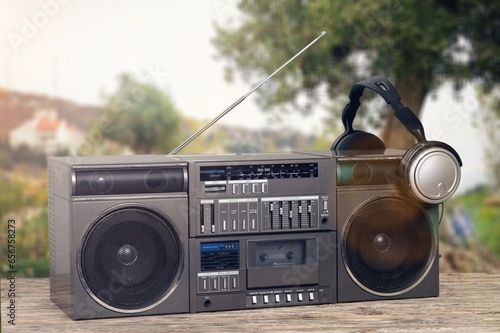 Retro radio or old cassette recorder on desk