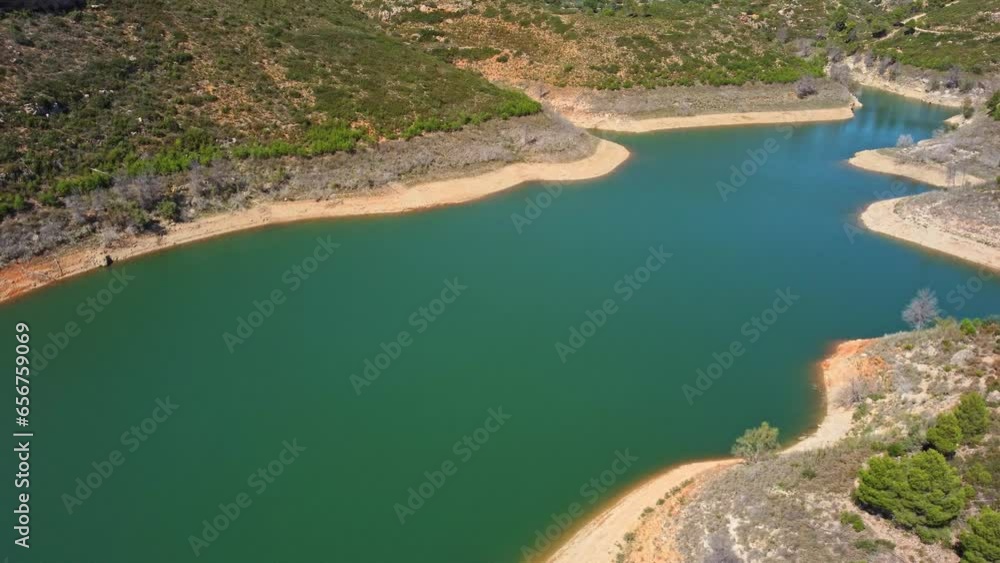 Aerial view of the reservoir with low level of water during a long drought. Forata reservoir, Valencia, Spain. Aerial view of the reservoir with low level of water during a long drought. Forata reservoir, Valencia, Spain.
